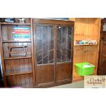 An oak and leaded glazed bookcase