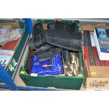 A box containing boots and silver plated cutlery e