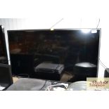 A Technika flat screen television with remote cont