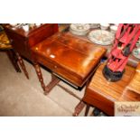 A Victorian rosewood sewing table with fold over t