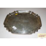 A silver presentation tray with pie crust border a