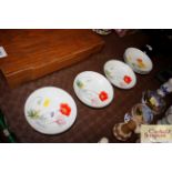 Six Noritake hand painted saucer dishes, signed