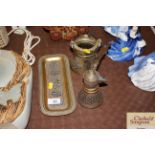 Three pieces of Middle Eastern brassware with whit