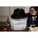 A Christy's bowler hat and cardboard hat box, the