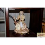 A Capo di Monte type figure group with maiden and