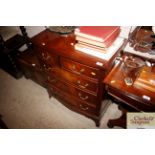 A reproduction mahogany bow fronted chest of two s