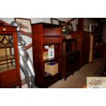 A mahogany open fronted tall bookcase fitted two d