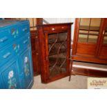 A Georgian mahogany hanging corner display cabinet