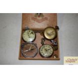 Three various pocket watches; a compass style watch; keys; badges etc.
