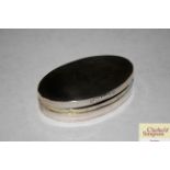 A continental white metal oval snuff box