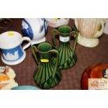 A pair of Bourne Denby twin handled green vases