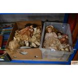 Two boxes of dressed dolls