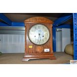A H.A.C oak cased twin hole mantel clock