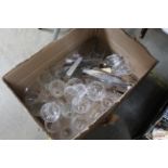 A box of various table glassware