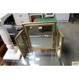 A triptych mirror contained in gilt frame