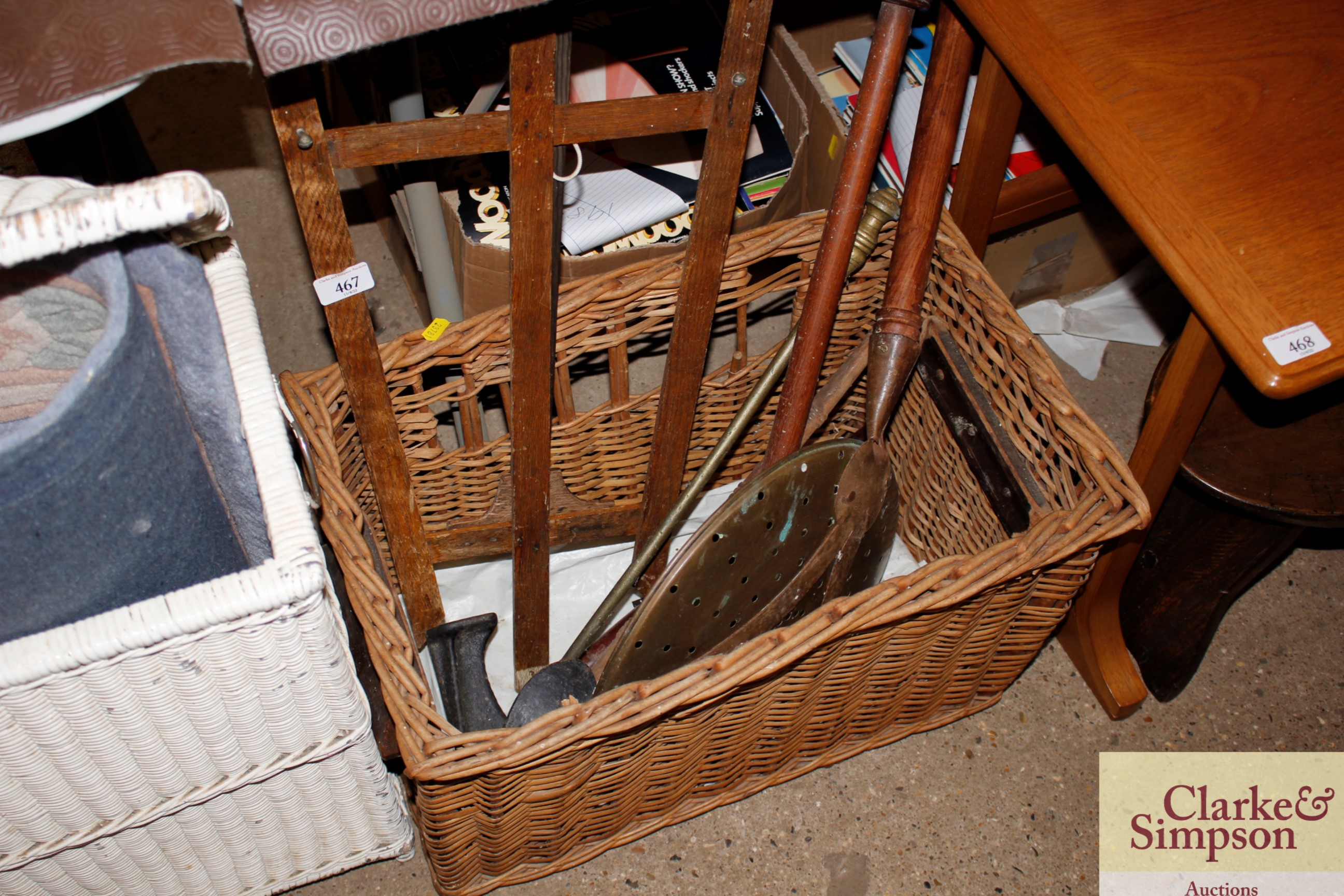 A wicker basket and contents of various metal ware