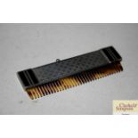 A silver and enamel decorated Art Deco comb