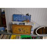 A quantity of mounted posters and embroidery etc.