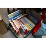 A box of various children's books and magazines