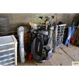 Two golf bags and contents and a golf trolley