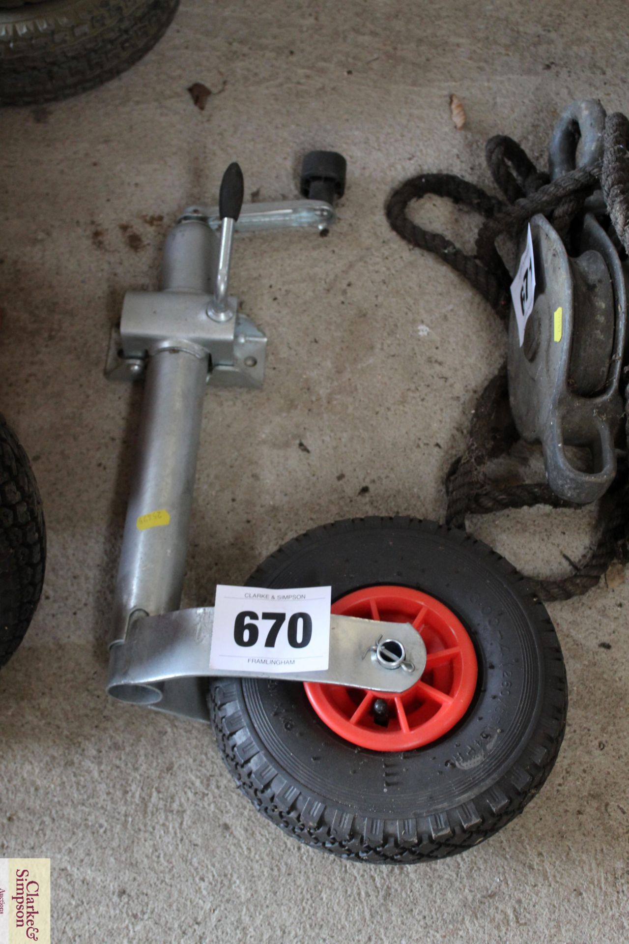 Unused trailer jockey wheel and clamp.