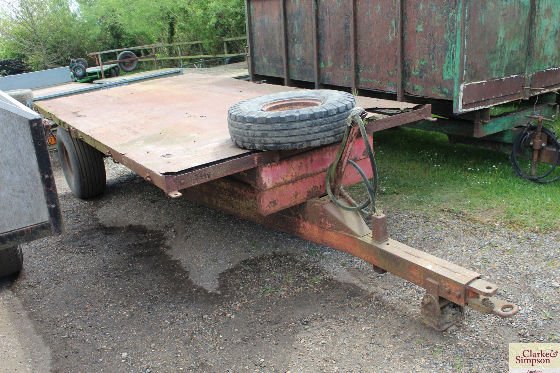 Pettit 4T single axle flat bed tipping trailer.