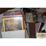 A box and a case of various LP's