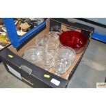 A box containing various table glassware