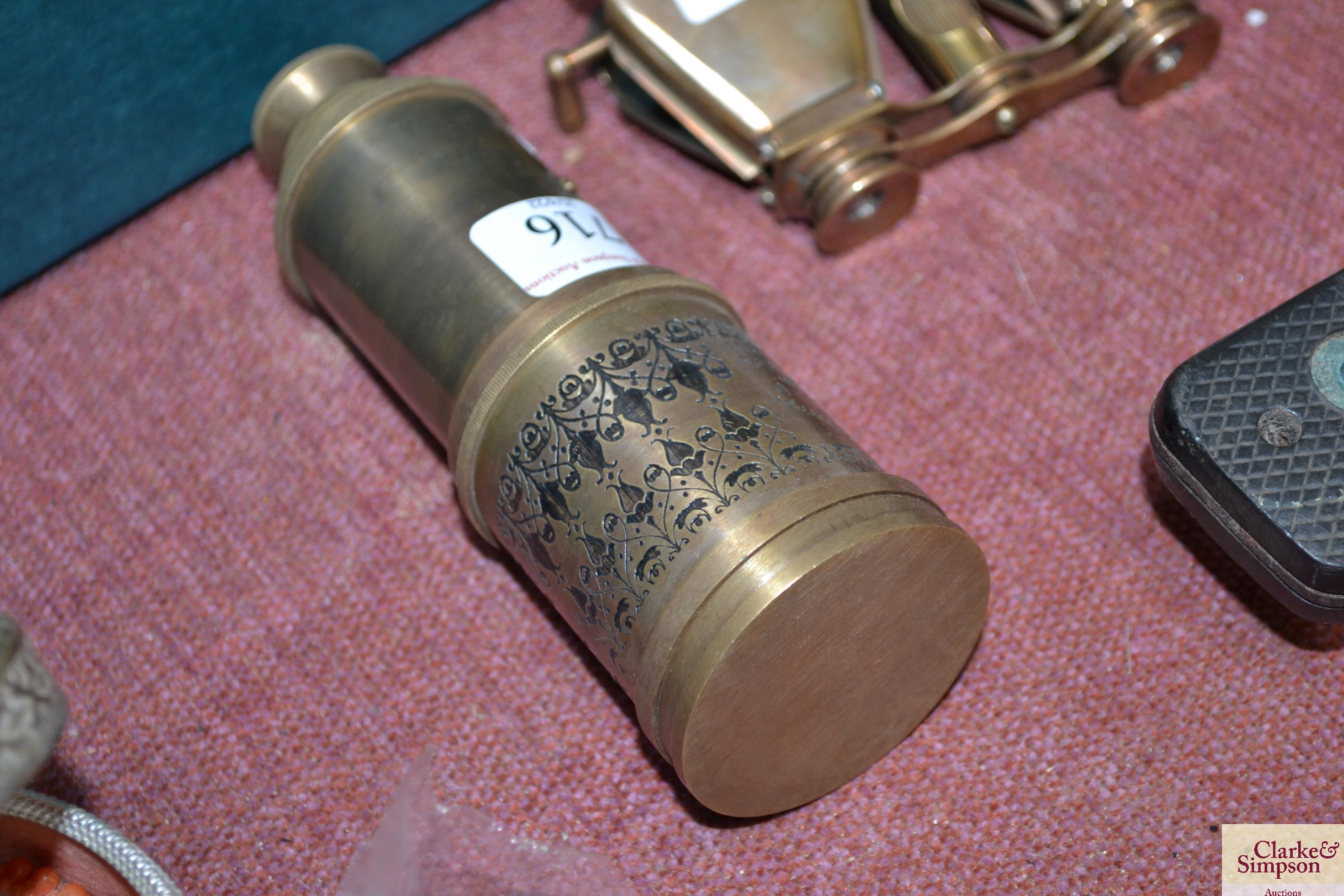 A reproduction brass telescope