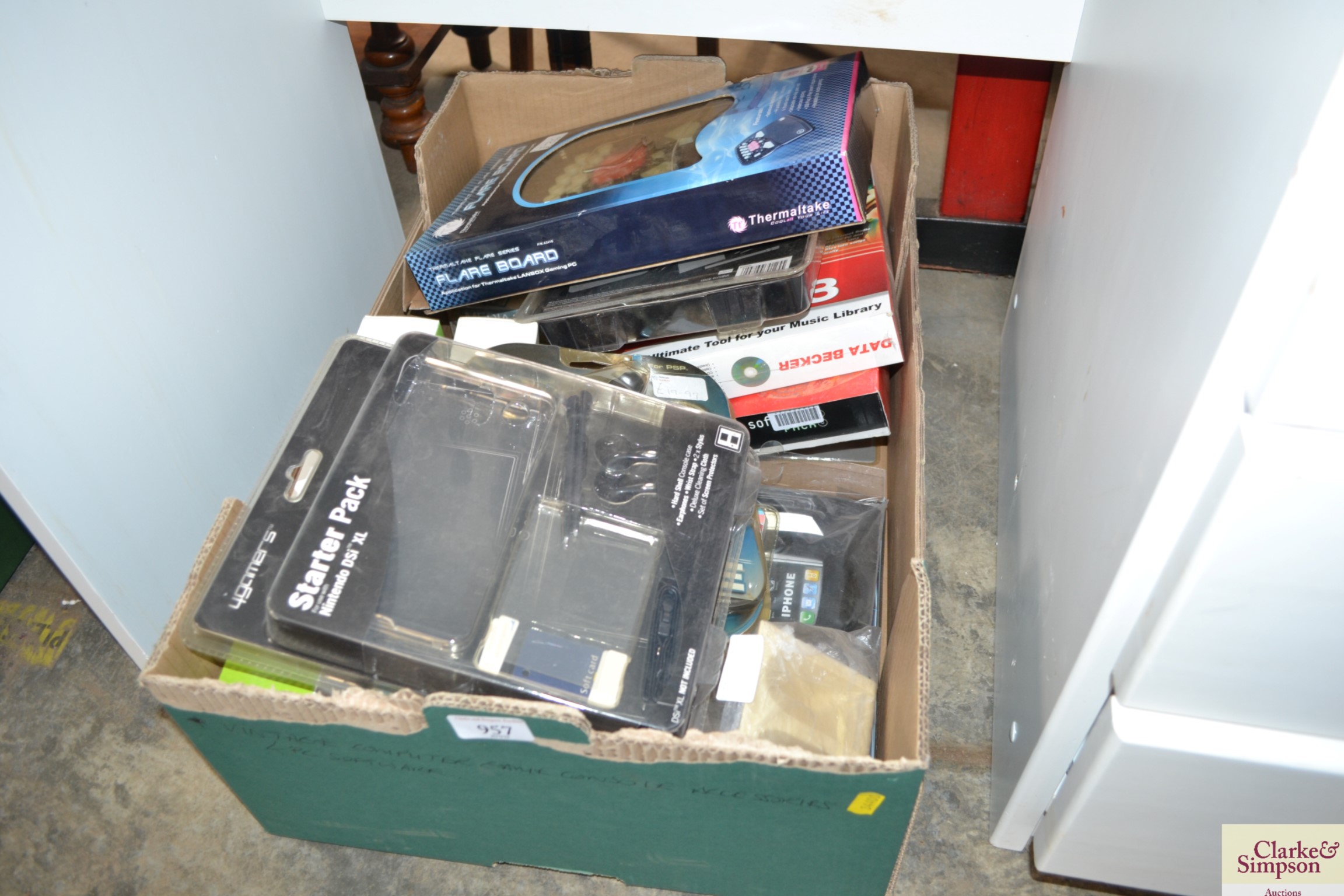 A box containing various computer and games consol