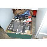 A box containing various computer and games consol