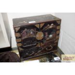 An Oriental lacquered trinket cabinet