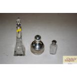 Three glass and silver mounted scent bottles