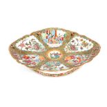 A 19th Century Canton oval comport, decorated in the traditional manner with figures in interiors,