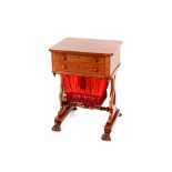 A 19th Century mahogany work table, fitted two drawers raised on lyre shaped end supports,