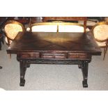 An oak library table, after a design by Bruce Talbert, overhanging parquetry top raised on pierced