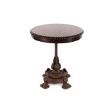 A circular mahogany tilt top occasional table, raised on a Victorian cast iron base, 66.5cm dia. x