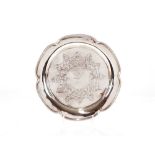 A Victorian silver dish of lobed shaped, with beaded border, having foliate scrolled centre,