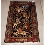 A Persian silk rug, decorated with horseman within foliate stylised borders and script, 150cm x