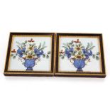 A pair of 18th Century Delft tiles depicting flowe