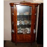 A French king wood, satin wood and chequer banded vitrine, having gilt metal mounts, bowed ends,