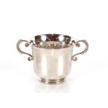 A small silver porringer, flanked by beaded twin handles, Birmingham late 20th Century , 5cm high,
