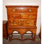 An 18th Century walnut three drawer chest, on stand, the stand fitted with pull out slide and pistol
