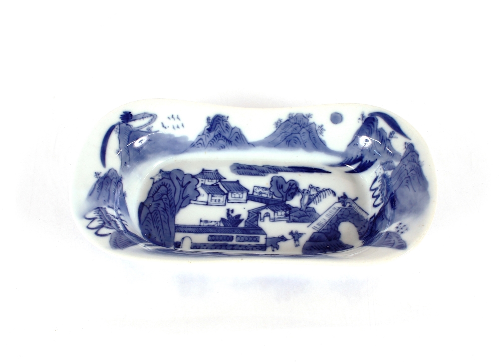 An early 20th Century Oriental porcelain rectangular dish, decorated in underglaze blue with