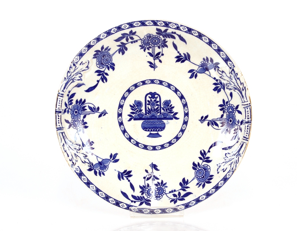 A 19th Century "Delph" blue and white plate, 24.5cm dia.