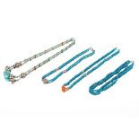 Four white metal and turquoise necklaces