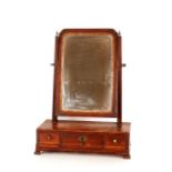 An 18th Century mahogany swing toilet mirror, with original glass plate above a three drawer base