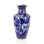 A large Japanese blue and white baluster vase, with profuse floral decoration, 56cm high