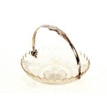 A 19th Century cut glass and Dutch silver mounted swing handled fruit dish, 28cm dia.