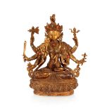 A gilt bronze figure, of a Deity with turquoise and coral coloured inset stones, 22cm high